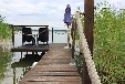 Urlaub im Bootshaus am See mit Steg und Motorboot